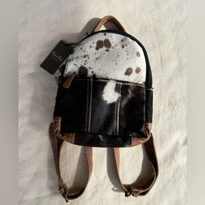 Myra compact hair on backpack with cow hide